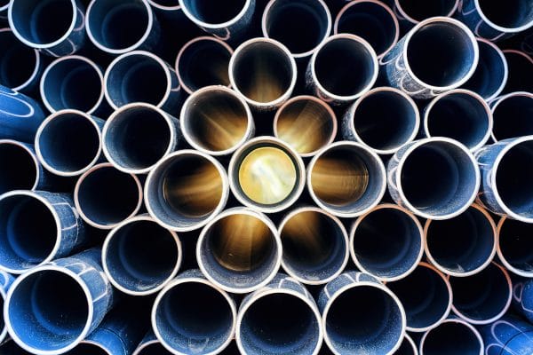 Abstract pattern of aged pvc pipe with sun lights