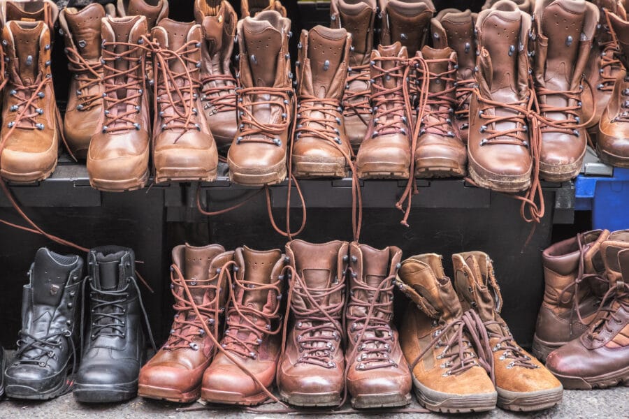 Secondhand combat brown boots on display at Brick Lane Sunday market in London