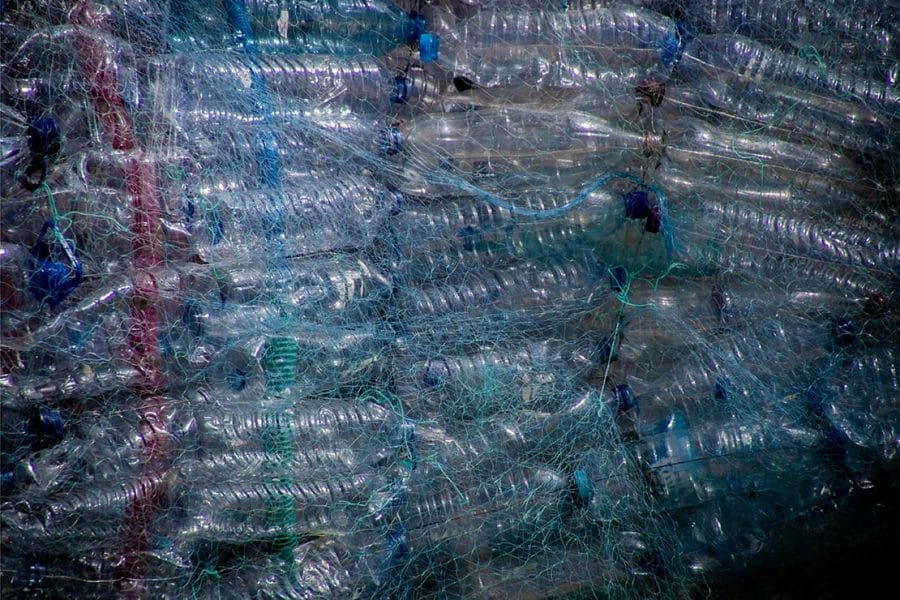 Piles of plastic water bottles in netting