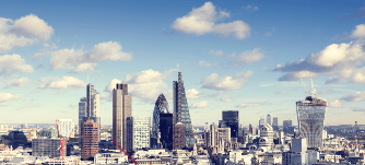 Photograph of London skyline with the landmark corporate buildings of the City of London and Canary Wharf.